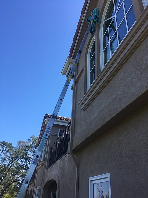 Professional window cleaning on a residential home in Waterbury Connecticut New Haven County